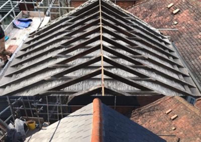 Re-slating roofs in London